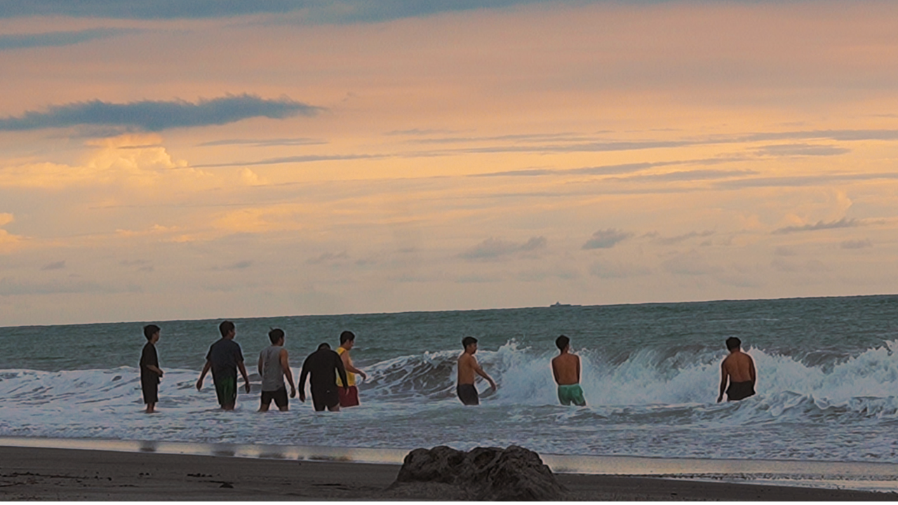 Zambales Tourists enjoy the beach of Liwliwa