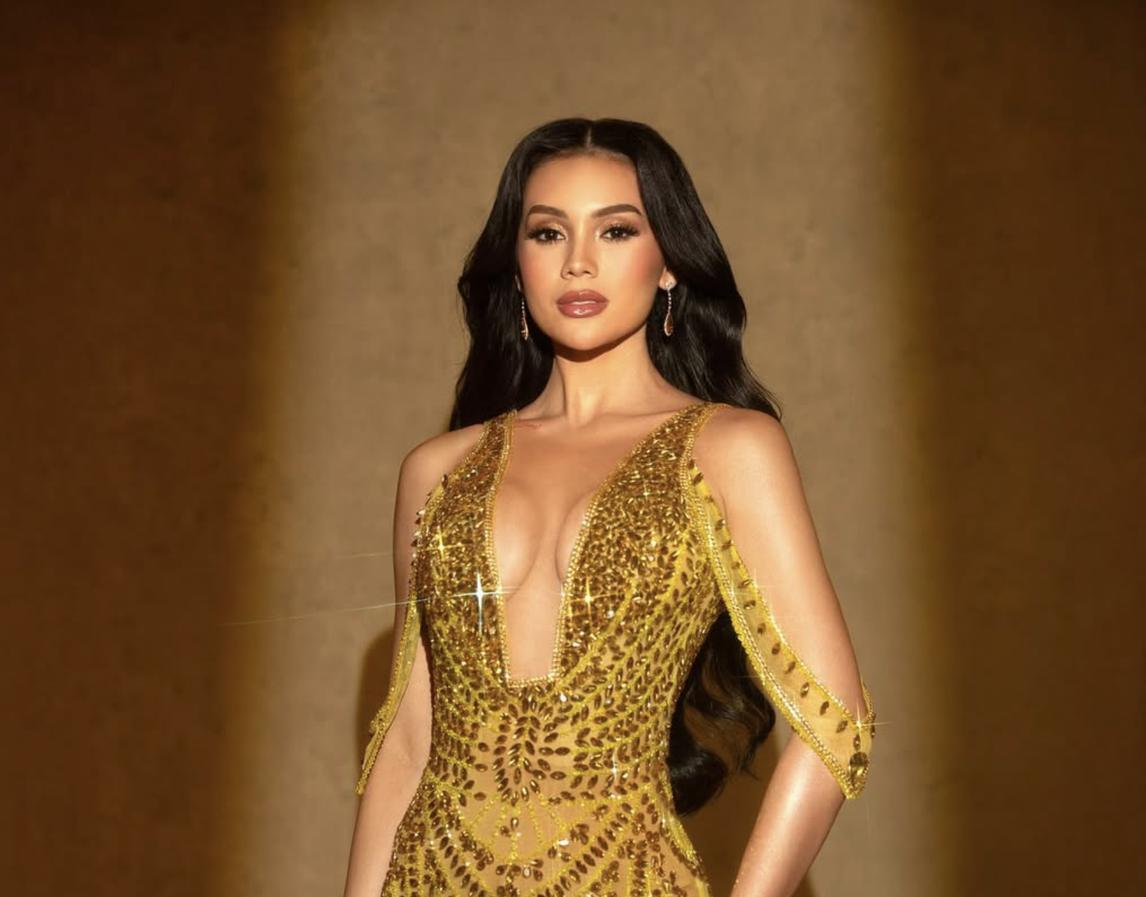 Michelle Arceo is Miss Tourism International Philippines 2026 in long gold gown by Rian Fernandez.
